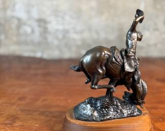 “Weaver”, a bronze sculpture after listed artist C.M. Russell. Signed as shown in photos and measures, 8” H x 6” W x 5” D. Charles Marion Russell, also known as C. M. Russell, Charlie Russell, and “Kid” Russell, was an American artist of the American Old West. He created more than 2,000 paintings of cowboys, Native Americans, and landscapes set in the western United States and in Alberta, Canada, in addition to bronze sculptures.
