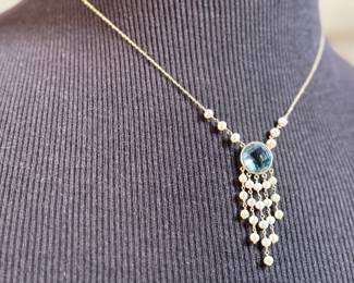 This lot features a stunning antique 14k gold necklace, possibly Edwardian with what appears to be Aquamarine and surrounded Pearls. This necklace measures 18” with a total approx. weight of 4.70 grams.
