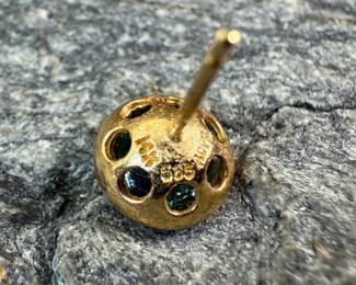 This lot features a pair of beautiful antique 14k gold earrings, each with a center stone that appears to be blue topaz and a total approx. weight of 2.05 grams.
