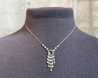 This lot features a stunning antique 14k gold necklace, possibly Edwardian with what appears to be Aquamarine and surrounded Pearls. This necklace measures 18” with a total approx. weight of 4.70 grams.

