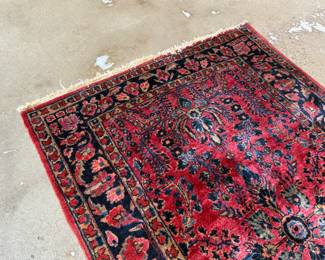 This lot features an antique handwoven Sarouk rug that measures, 74” H x 48” W.

