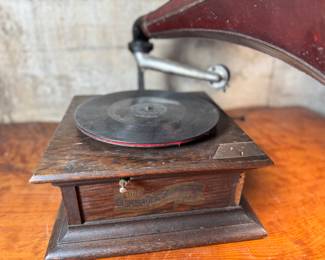 This lot features an antique Columbia Gramaphone with a large horn included. Gramophones were mechanical devices used for the reproduction of sound. The term "gramophone" was coined by its inventor, Emile Berliner, in the late 1880s. Comes untested.
