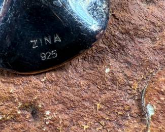 This lot features a pair of sterling silver earrings, manufactured and signed by ZINA with a total approx. weight of 10.94 grams.
