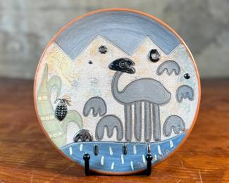 This lot features a piece of Seminario ceramics from Peru. The style, known as Seminario, was developed by Peruvian artists Pablo Seminario and his partner Marilú Behar. Based in the town of Urubamba in the Sacred Valley of the Incas, the artists’ work is inspired by the techniques and motifs of ancient Peruvian cultures, with a contemporary influence and unique artistic expression. Pablo Seminario’s work has been acquired by several museums, including the Smithsonian. This place measures, 7.75” across.
