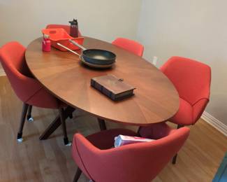 Mid-Century Modern Dining Set with Orange Chairs
Stunning mid-century modern oval dining table with four vibrant coral/orange upholstered chairs. Walnut wood finish table with tapered legs, perfect for modern dining room, kitchen, or breakfast area. Retro furniture, contemporary dining set.