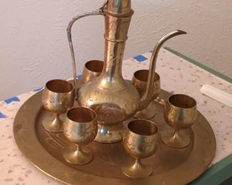 Brass Middle Eastern Coffee/Tea Service Set
Ornate brass Middle Eastern tea or coffee service set with etched decorative pitcher, tray, and six goblets. Traditional Arabic coffee set, vintage brass serving set, decorative home decor, collectible serving ware.