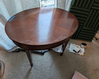 $50 Round Dark Wood Side Table
Classic round coffee table in rich dark wood finish with lower shelf storage. Traditional furniture piece perfect for living room or sitting area. Solid wood construction, rustic farmhouse style.