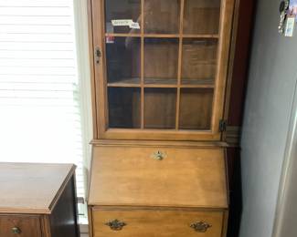 #23 maple sectary with flip desk 3 drawers 1 glass door 26x16x72 $125.00