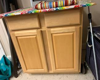 #89 maple 2 drawer 2 door cabinet with board on top $45.00