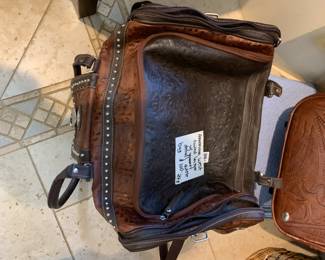 #243 American Wets tooled Leather w/grommet Detail Duffle $100.00