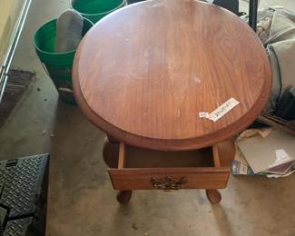 #95 oval oak end table with drawer 24x28x24 $35.00