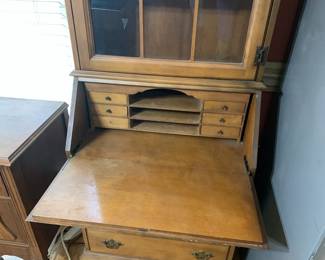 #23 maple sectary with flip desk 3 drawers 1 glass door 26x16x72 $125.00