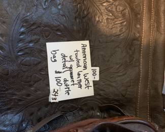 #243 American Wets tooled Leather w/grommet Detail Duffle $100.00