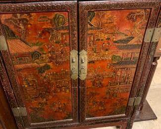 #135 Oriental cabinet with 2 doors red black cabinet with 2 doors as is 33x16x45 brass cat lock $75.00