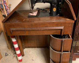 #137 sewing cabinet singer with mid century style cabinet 3 drawers 29x17x32 $45.00