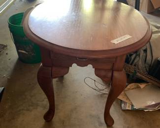 #95 oval oak end table with drawer 24x28x24 $35.00