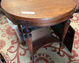 #70 round table with shelf 24x31 wood $75.00