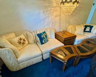 Four-piece sectional sofa, three-piece coffee table, end table cabinet.