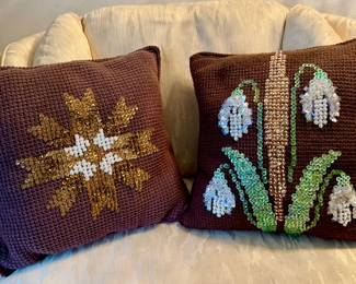 Selection of hand-made pillows, all different decorations.