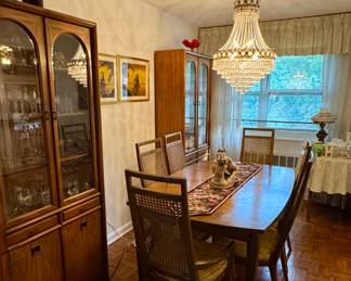 Dining room table available with four chairs and two hutches.