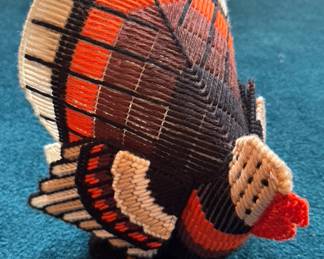Hand-made turkey craft item.