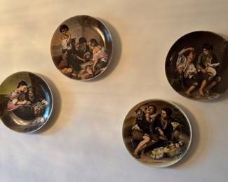 Four Italian decorative wall art plates.