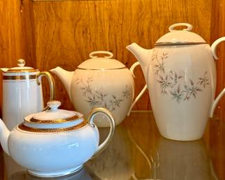 Lenox china teapot and coffee pot (right) and white Greek key tea pot and coffee pot.