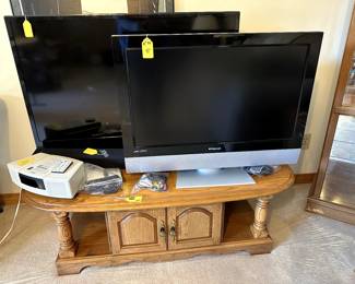 Insignia 56" TV, Polaroid 32" TV, Sound bar, Bose Wave Radio/CD