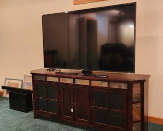 Media stand pictured with 65" Flatscreen TV