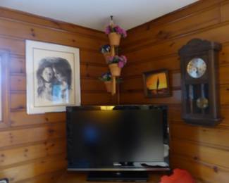 TV, framed pictures, antique wall clock