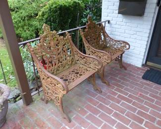 Pair of antique ornate iron chairs