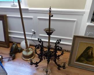 Antique wrought iron chandelier with glass globes