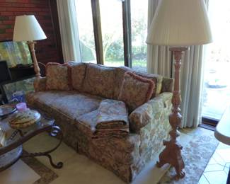 Sofa, coffee table pair of accent chairs, pair of floor lamps, area rug, bric-a-brac