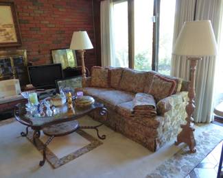 Sofa, coffee table pair of accent chairs, pair of floor lamps, area rug, bric-a-brac