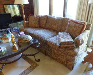 Sofa, coffee table pair of accent chairs, pair of floor lamps, area rug, bric-a-brac