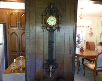 Decorative wall clock with wrought iron pendulum