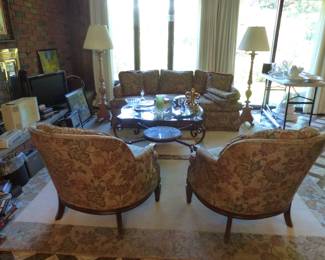 Sofa, coffee table pair of accent chairs, pair of floor lamps, area rug, bric-a-brac