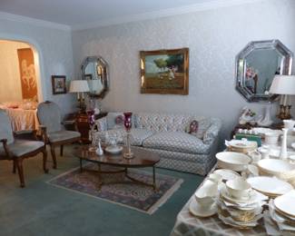 Traditional tufted back sofa, oval coffee table, pair of accent chairs, pair of Karges side chests, pair of mirrors, oil painting signed by Joan Giralt Lerin, pair of lamps