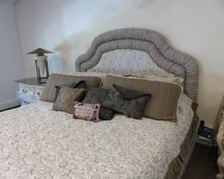 King size upholstered bed with box spring/mattress, bedding & accent pillows, pair of marble top Bombay chests, pair of iron benches