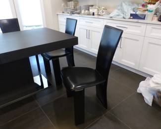 Contemporary designer dining table with 6 designer leather chairs