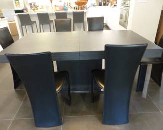 Contemporary designer dining table with 6 designer leather chairs