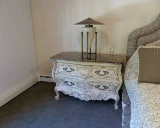 King size upholstered bed with box spring/mattress, bedding & accent pillows, pair of marble top Bombay chests, pair of iron benches