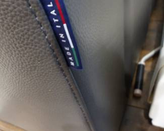 Chateau d'Ax Italian leather sectional sofa, coffee table with slide out benches