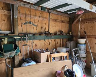 More tools, sprayers, hose, wooden table