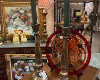 Beautiful vintage brass unusual and large candlesticks with green candles. Beautiful glass plate, floral oil of teapot and flowers.