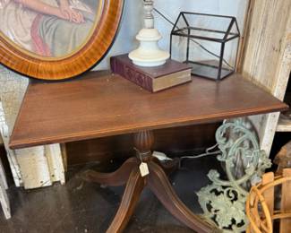 Antique short side table with brass tipped legs 