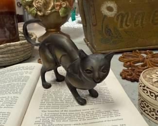 Brass Cat Figurine, vintage books, floral ceramic topiary