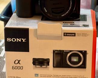 Absolutely Brand New never used! Alpha 6000 Sony Mirrorless Digital Camera in original box and wrapping