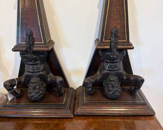 Pair of bronze and leather wall mounted obelisks