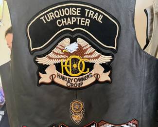 Large selection of motorcycle jackets + gear, including Harley Owner’s Group/Turquoise Trail Chapter leather vest